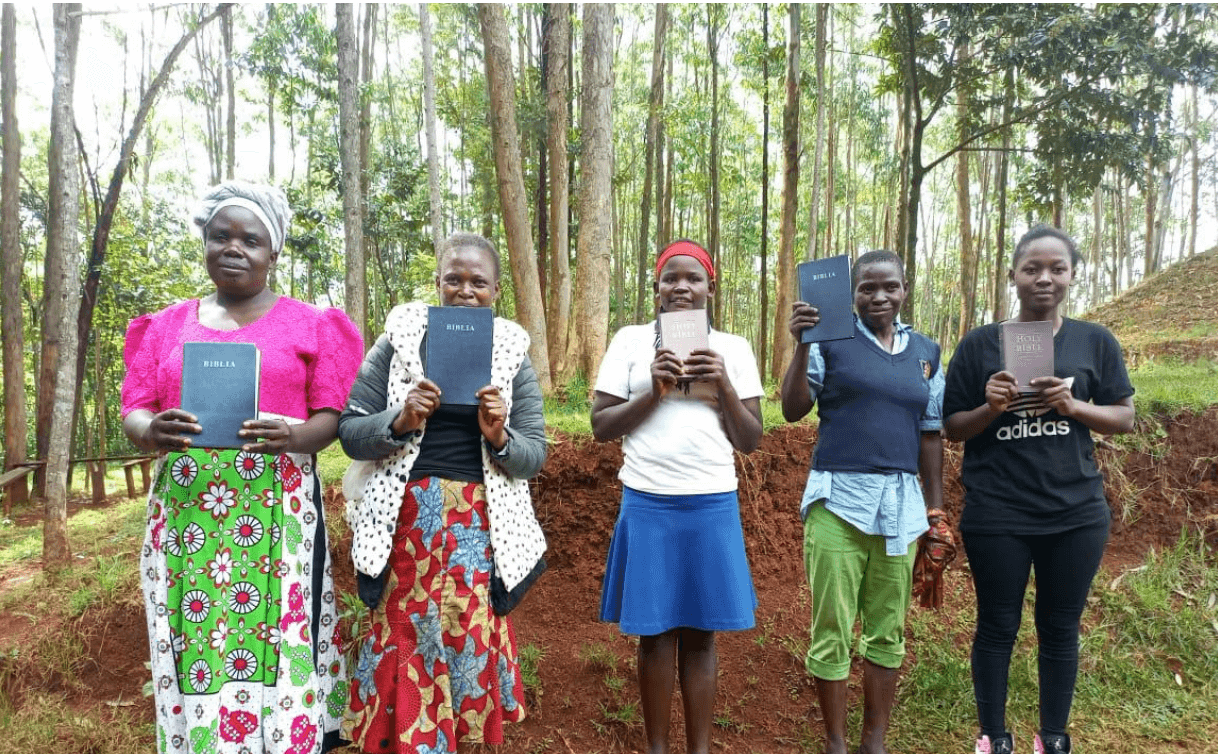 Women with their donated Bibles 